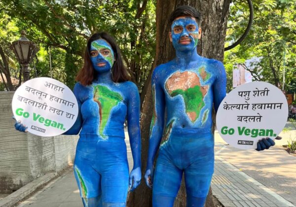 Body-Painted Pair Resembling Planet Earth Call for Vegan Meals Ahead of Earth Day