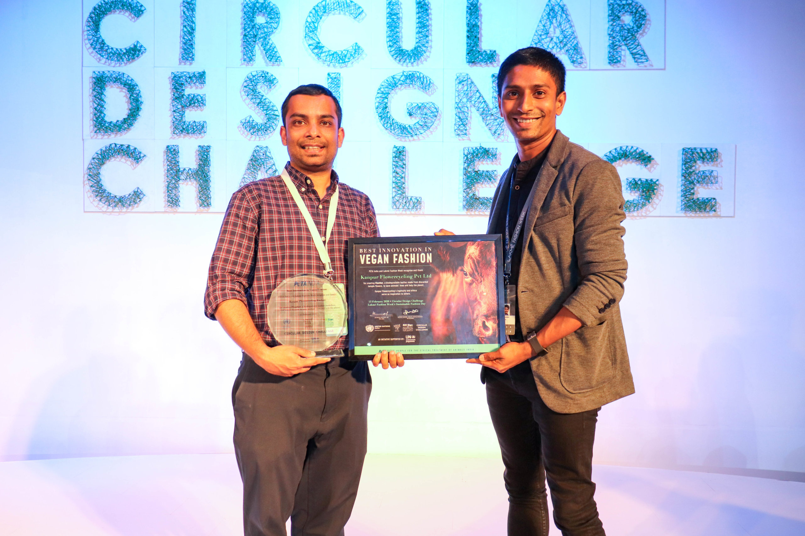 Ankit Agrawal (Left) receiving award from Sachin Bangera, Director of Public Relations and Celebrity at PETA India 